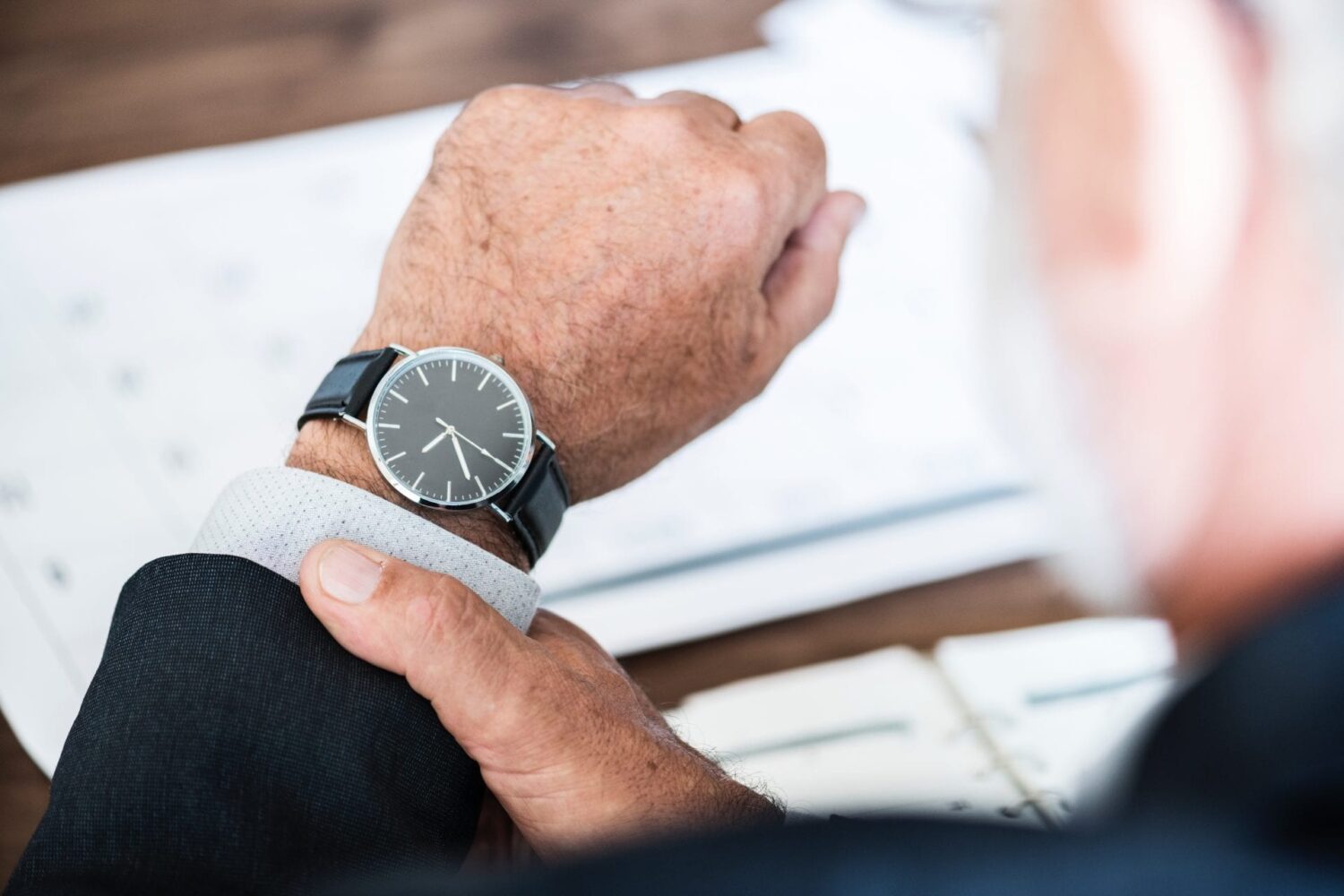 Man looks at his watch