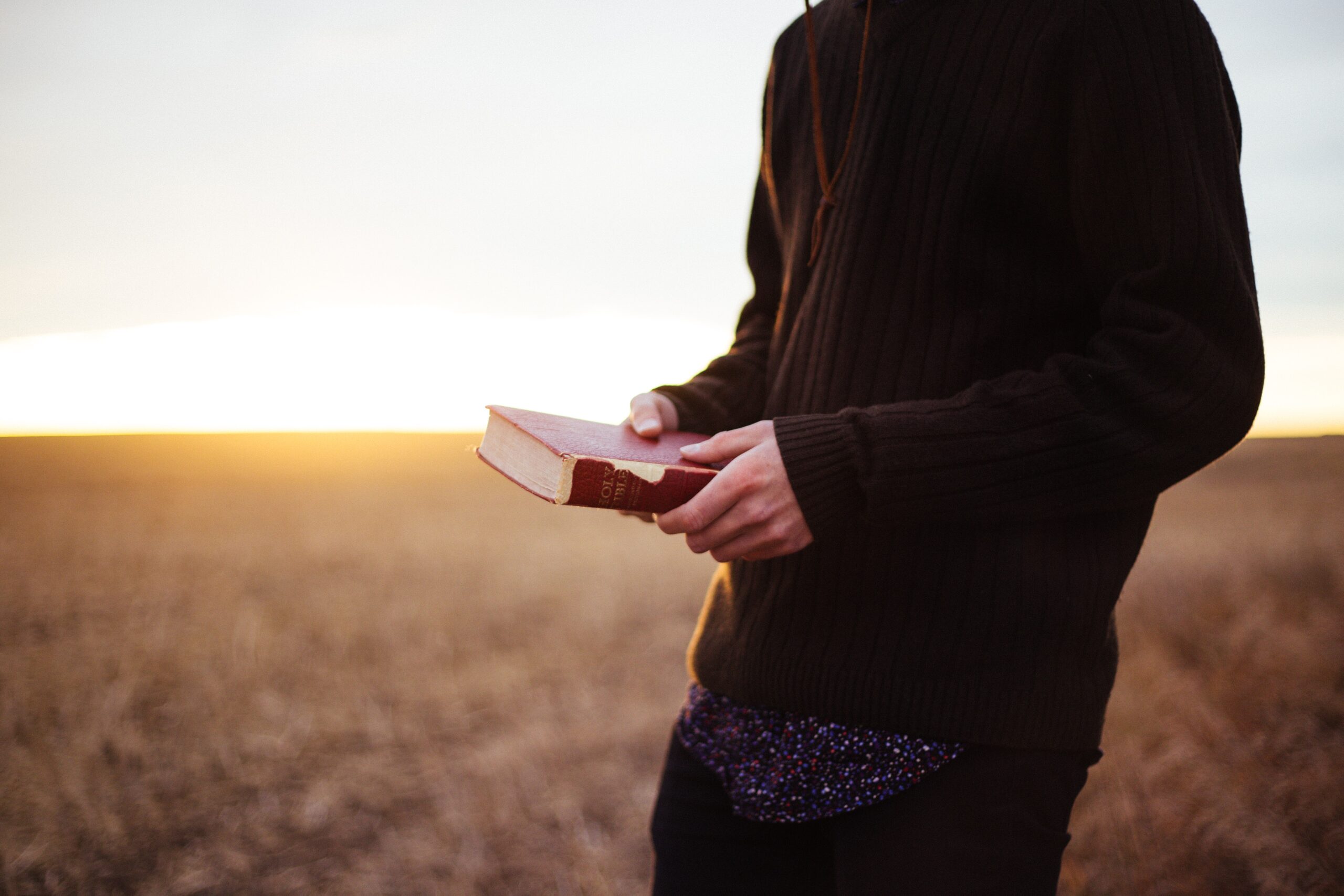 Man holds a Bible